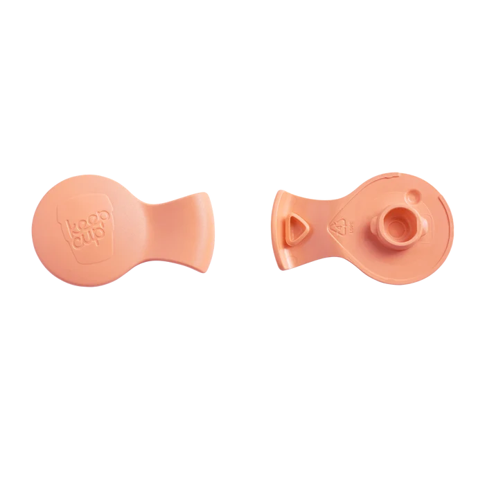 Splashproof Plug in Mandarin Blush shown from two angles against a white background, displaying the smooth top surface with embossed KeepCup logo and the underside featuring the plug mechanism and recycling symbol.