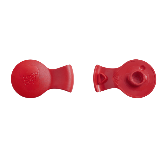 Top and bottom view of the KeepCup Splashproof Plug in Poppy, showing the smooth red exterior with embossed KeepCup logo and the underside featuring the silicone sealing mechanism.