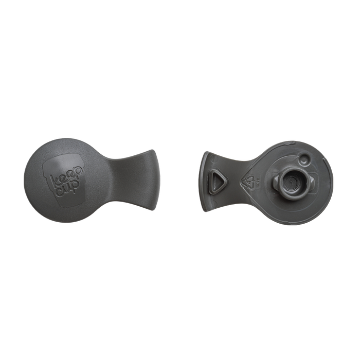 Front and back view of the KeepCup Splashproof Plug in Smoke, showing the embossed KeepCup logo on the top side and the underside with recycling symbol and plug mechanism.