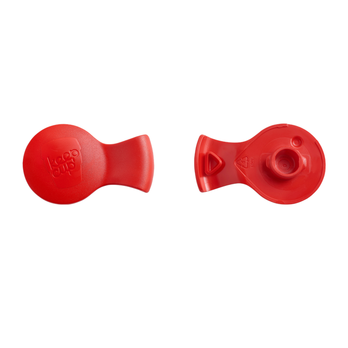 Top and underside view of the KeepCup Splashproof Plug in Tomato Red, showing the smooth branded surface and the plug mechanism designed to fit S/M/L sized lids.